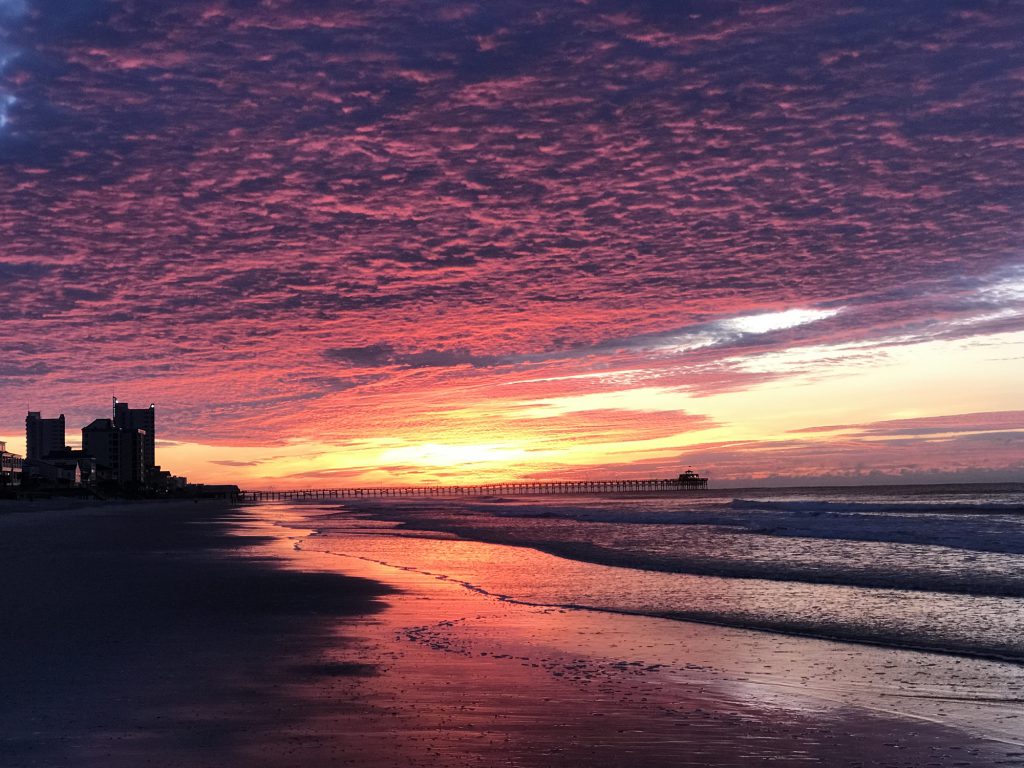 Sunrise early red ski beach water